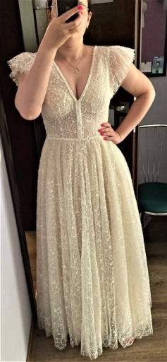 Zdjęcie oferty: Kremowa suknia ślubna z koronki
