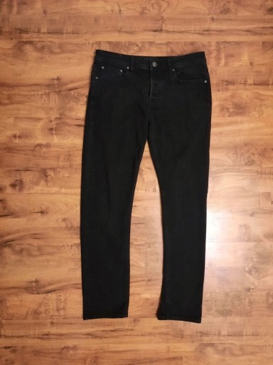 Zdjęcie oferty: Czarne rurki, jeansy Jack&Jones 30/32, M z l. wadą