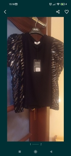 Zdjęcie oferty: Sweterek czarny z ozdobnymi rękawami 