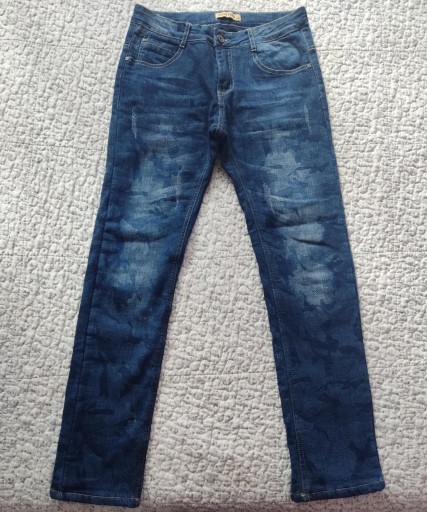 Zdjęcie oferty: Nowe spodnie jeansy marmurkowe ocieplane polarem r.158