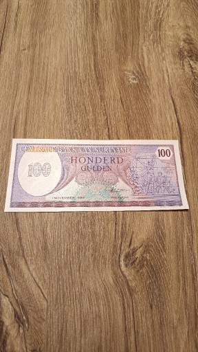 Zdjęcie oferty: Surinam 100 Gulden 1985 UNC z paczki bankowej 