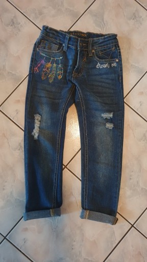 Zdjęcie oferty: Spodnie jeansy dziewczęce z aplikacją 122-128cm