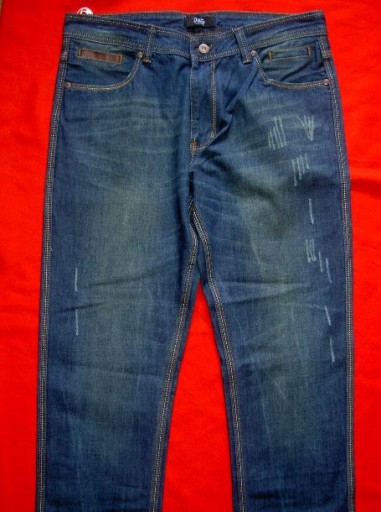 Zdjęcie oferty: Spodnie jeansowe z przetarciami i skórzane wstawki