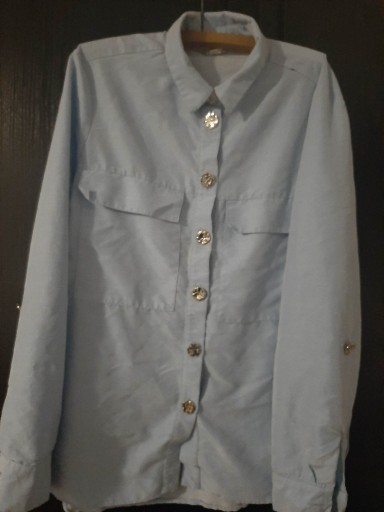 Zdjęcie oferty: Jasnoniebieska koszula damska, rozmiar 38.