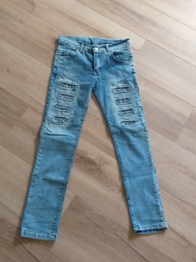 Zdjęcie oferty: Sprzedam jeansy dla dziewczynki 9-11 lat