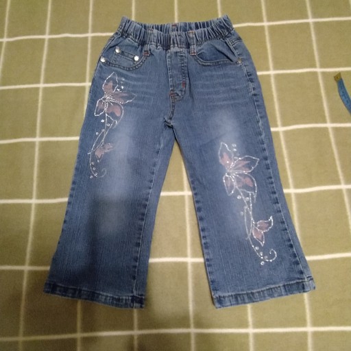 Zdjęcie oferty: Spodnie jeans z wzorem kwiatowym rozm. 92