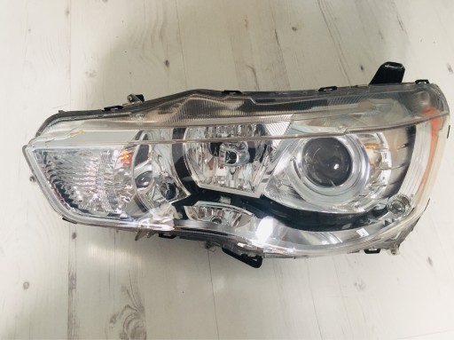 Zdjęcie oferty: Reflektor mitsubishi outlander lancer xenon Europa