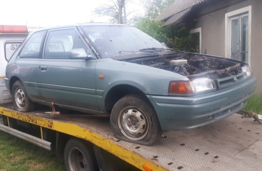 Zdjęcie oferty: Mazda 323 BG IV Zderzak drzwi szyba