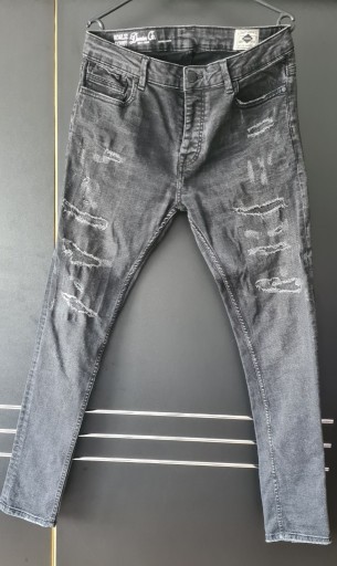 Zdjęcie oferty: Czarne spodnie jeansy z przetarciami slim Denim Co