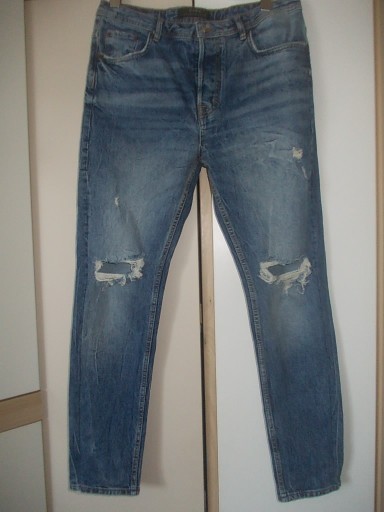 Zdjęcie oferty: Zara spodnie jeansowe dziury.42