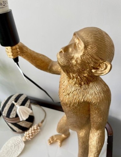 Zdjęcie oferty: Lampa stołowa Małpa koloru złotego