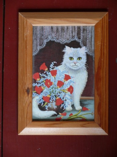 Zdjęcie oferty: Obrazek w ramce Kot siedzący za kwiatami 