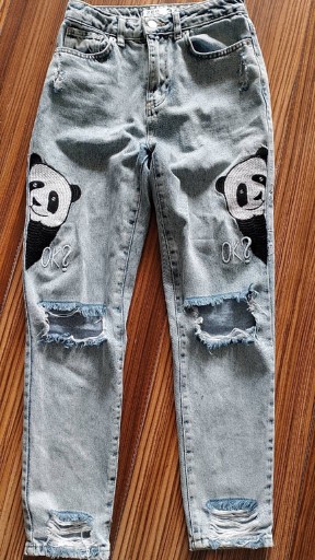 Zdjęcie oferty: Spodnie jeansowe z przetarciami rozmiar 34