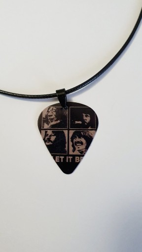 Zdjęcie oferty: Naszyjnik wisiorek piórko The Beatles John Lennon 