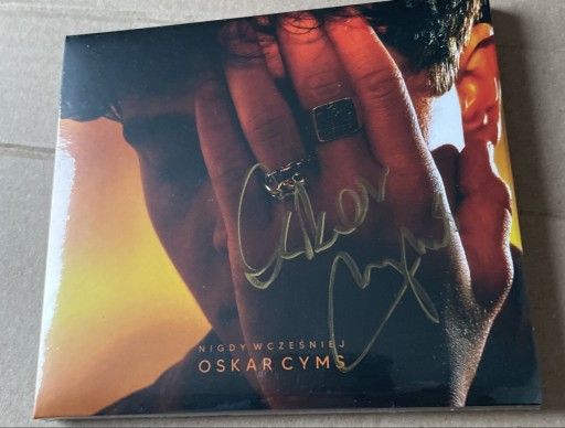 Zdjęcie oferty: autograf OSKAR CYMS NIGDY WCZEŚNIEJ CD z autografem