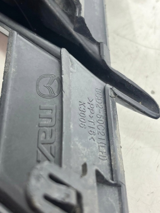 MAZDA 3 BL GRILLE PARE-CHOCS GAUCHE BCD2-50C21