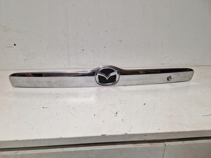 фото №1, Накладка планка крышки багажника зад mazda tribute 2.0 b 16v 00-07 124km