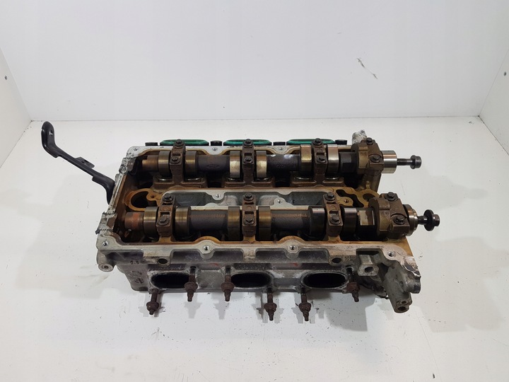 фото №1, Головка левая jaguar x-type 2.5b v6 4x4e-6090