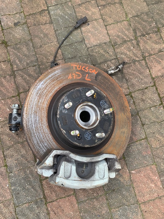 фото №1, Поворотный кулак ступица суппорт левый перед tucson 15r-