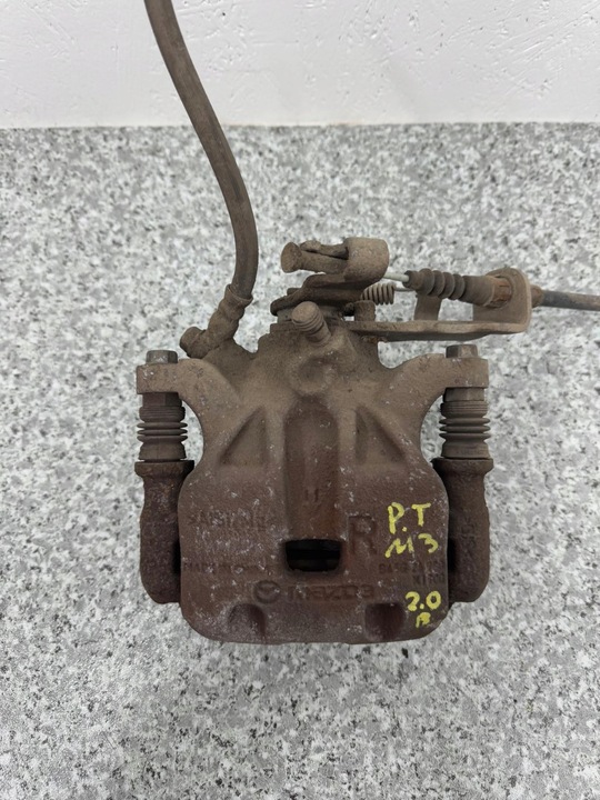 фото №7, Супорт скоба трос правий зад задній mazda 3 bm 13-