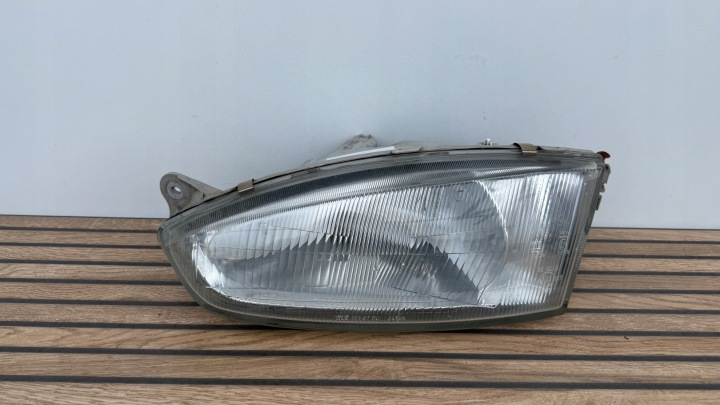 MITSUBISHI COLT 96-03 ROK left light front original 100-87148 K53/SI25