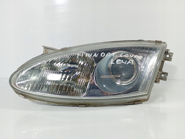 Hyundai Coupe 2 96-01 REFLEKTOR FANALE FARO sinistra Anteriore Anteriore OE 1010495
