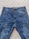 Zdjęcie oferty: Nowe spodnie jeansy marmurkowe ocieplane polarem r.158