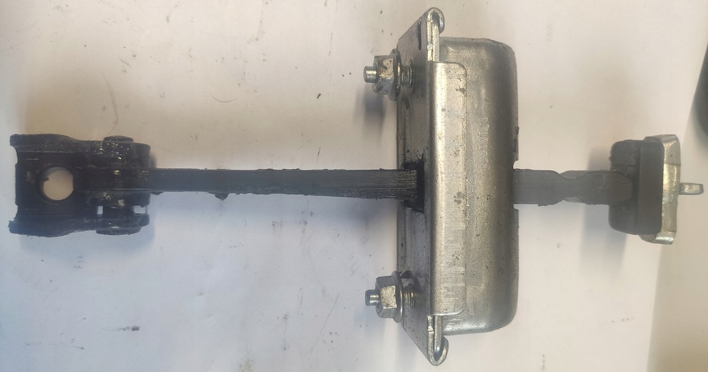 фото №1, Opel corsa e обмежувач двері задня лівий