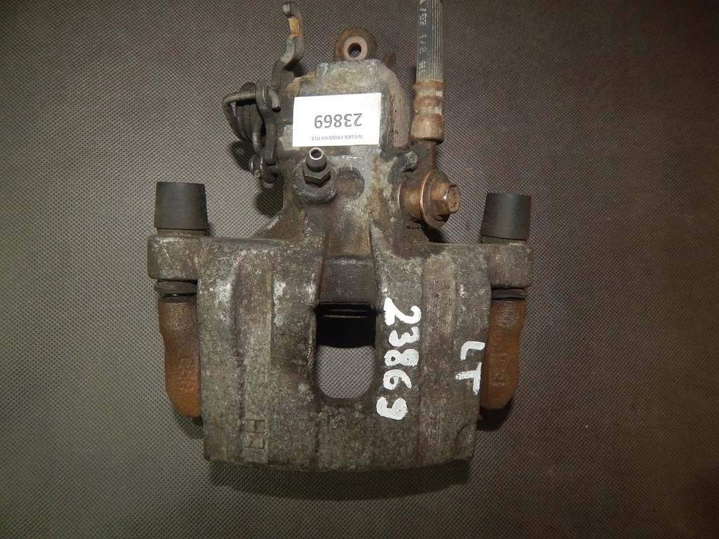 фото №1, Nissan primera суппорт тормозной левый задняя