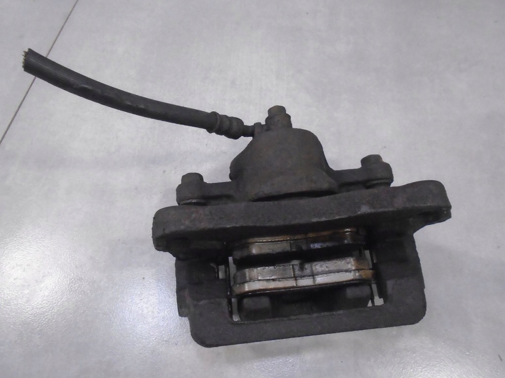 фото №1, Суппорт тормозной левый перед trajet 2.0 crdi