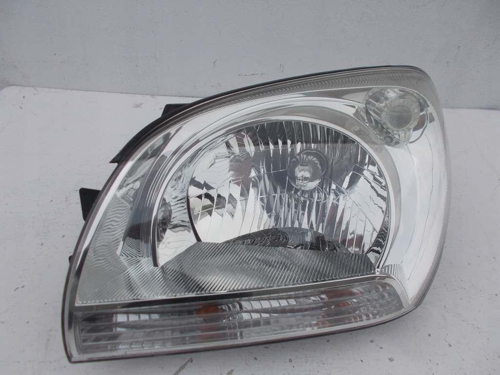 фото №1, Фара лампа kia sportage ii 2 europa левая