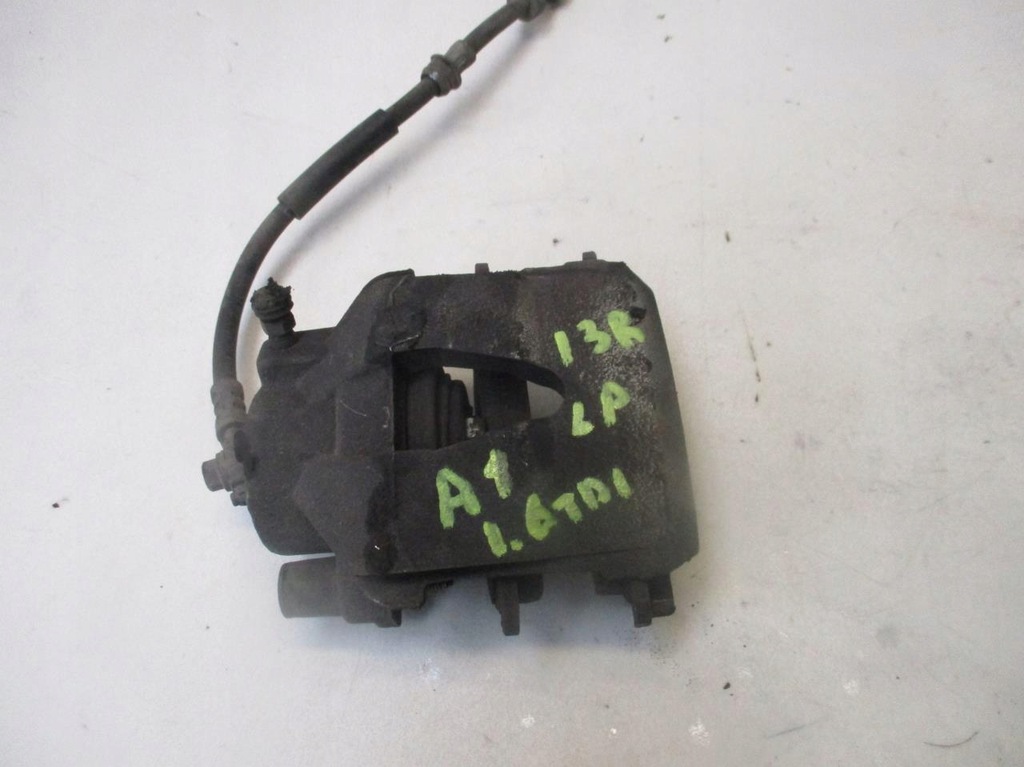 фото №1, Супорт гальмівний лівий перед audi a1 1.6 tdi