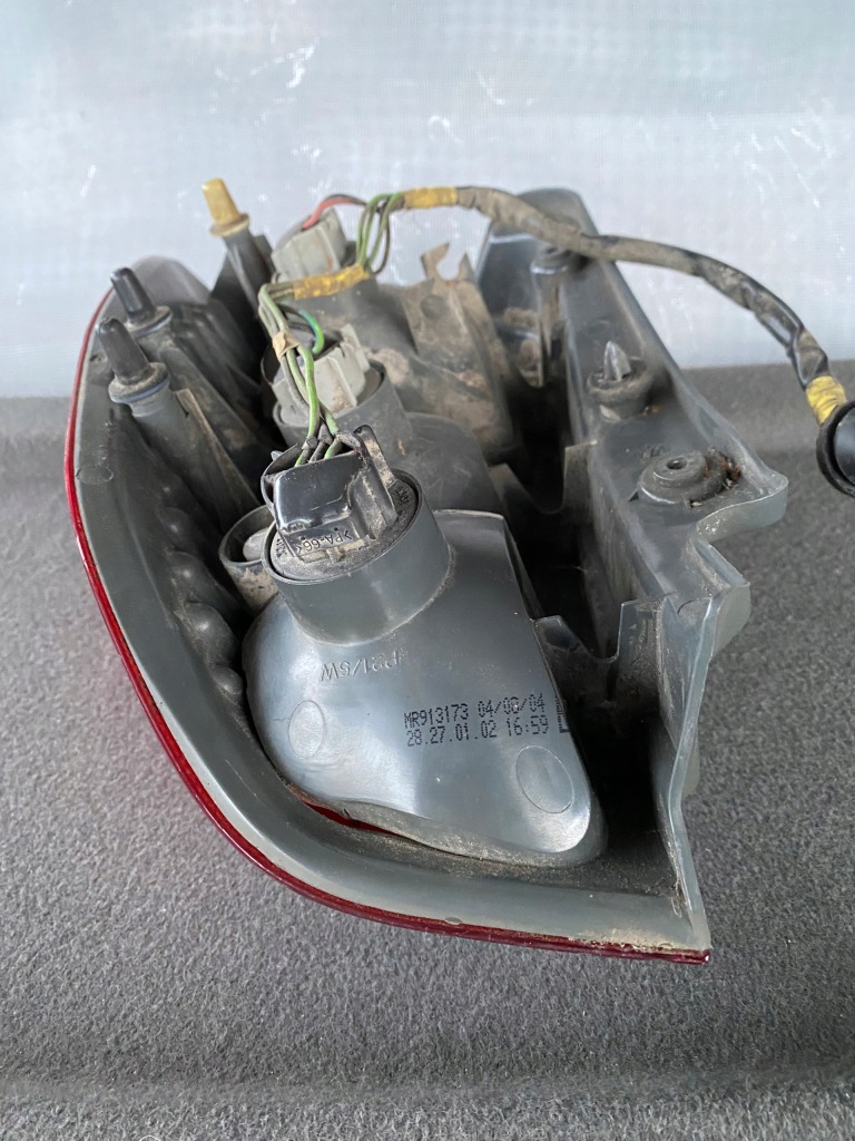 фото №14, Лампа левый задняя mitsubishi space star i lift + вкладыш - mr913173