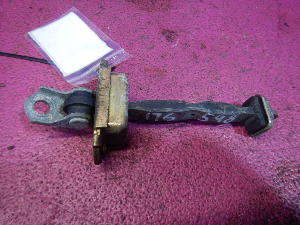 фото №2, Almera tino обмежувач двері перед передній лівий