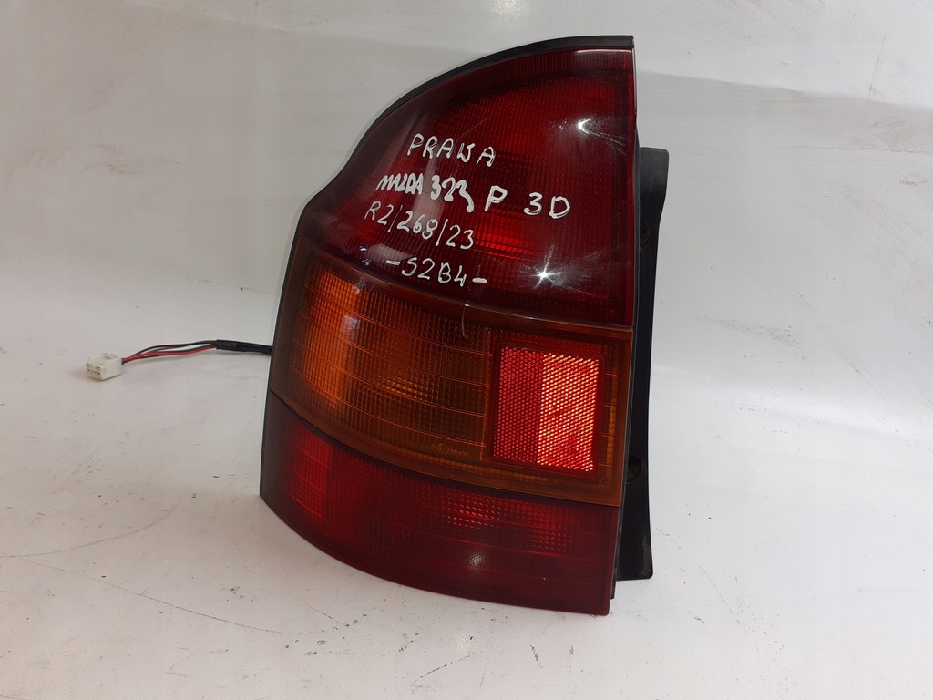 фото №1, Лампа левая задняя mazda 323p 3d