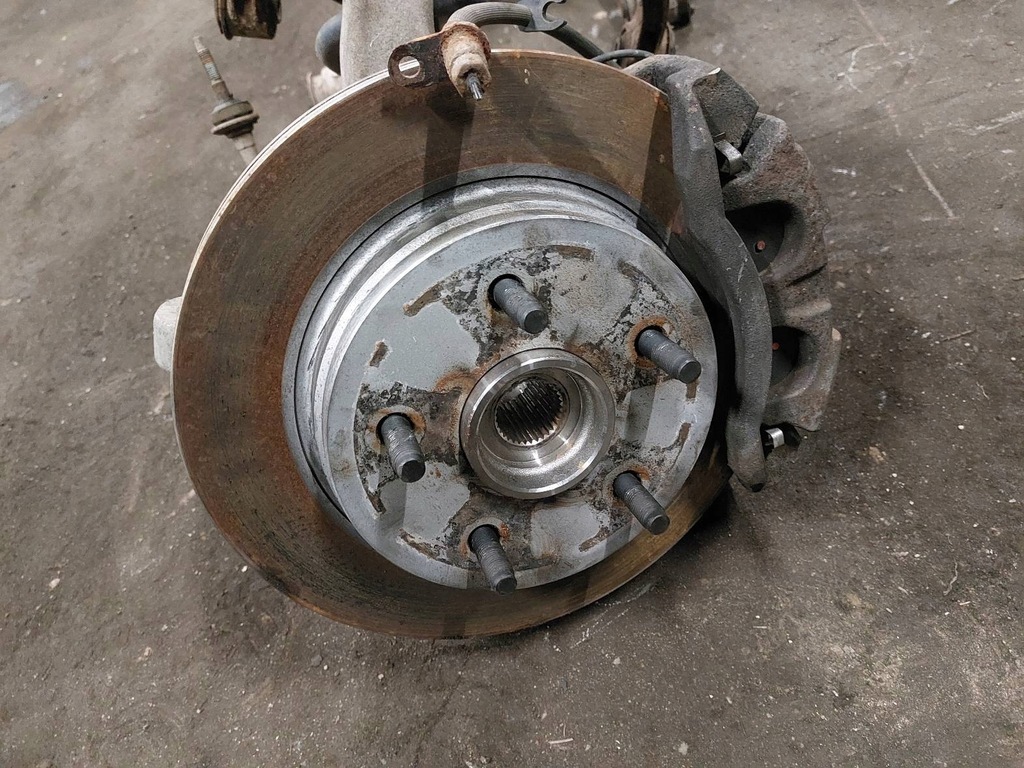 фото №11, Поворотний кулак амортизатори важелі гальмівні диски супорти перед ram 1500 i 5.7 13-