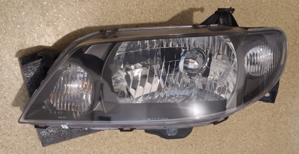 Mazda 323f bj рестайлінг  фара лівий 176 Оригінал