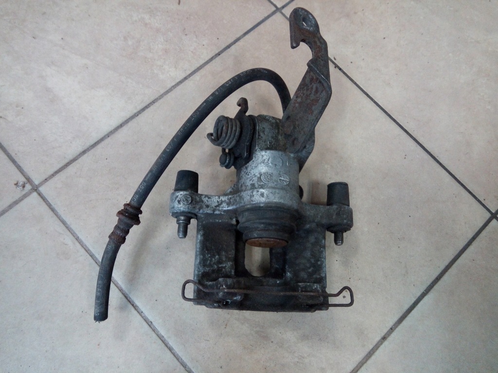 фото №1, Супорт гальмівний nissan primera p12 задня oryg ate