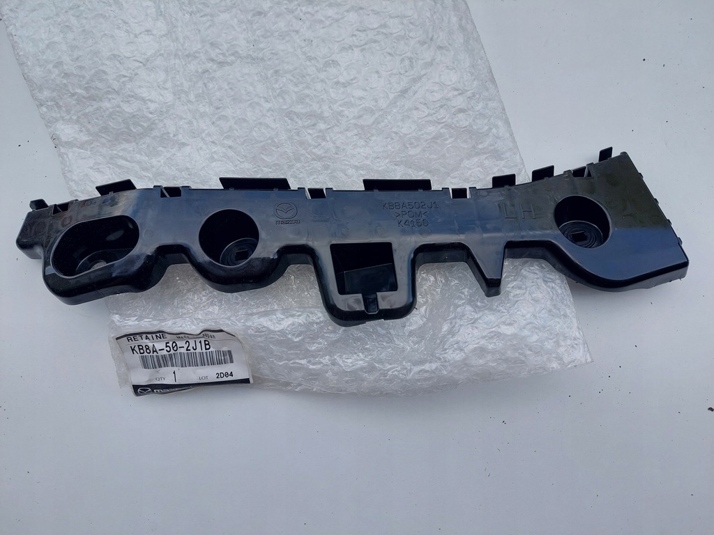 фото №1, Mazda оригінальний номер kb8a502j1b напрямна бампера