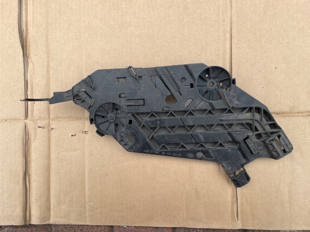 фото №1, Skoda octavia ii lift кронштейн направляющая лампы левый перед оригинал