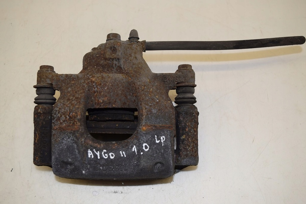 фото №1, Toyota aygo ii 1.0 суппорт тормозной левый перед