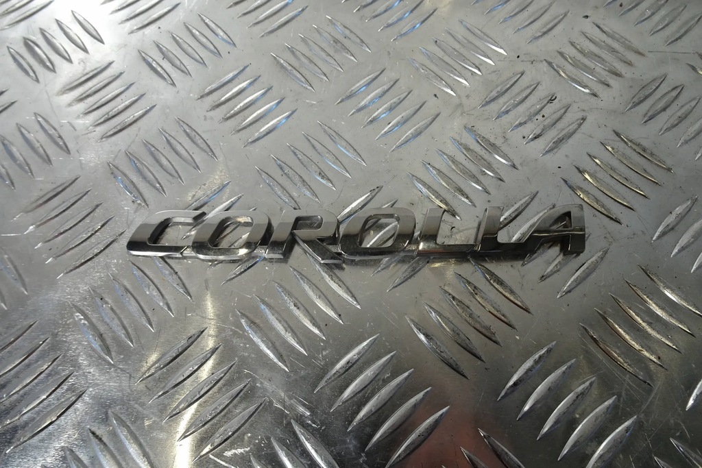 фото №1, Toyota corolla e21 sedan емблема logo кришки багажника 22-