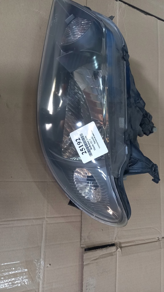 фото №1, Фара левый mazda 323f 03r