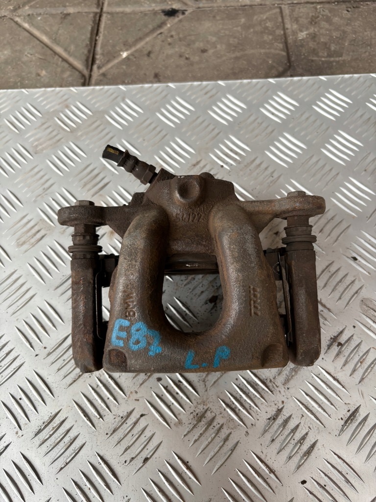 Купити Супорт гальмівний лівий перед bmw 1 e87