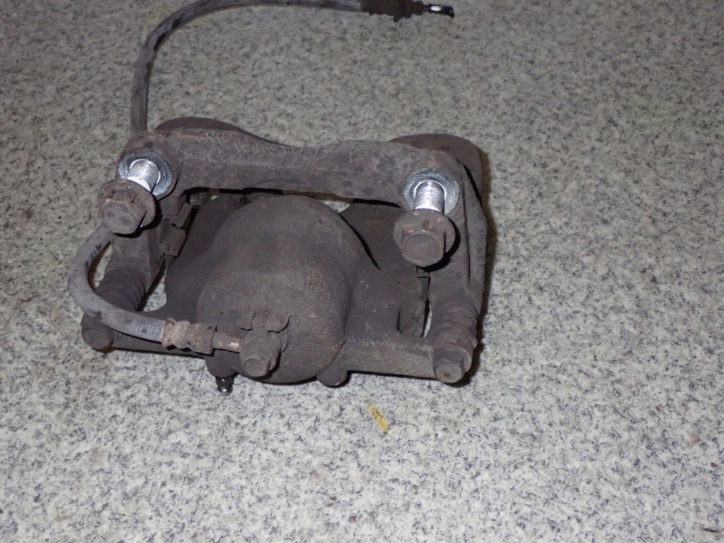 фото №4, Nissan xtrail x-trail t31 супорт передній правий