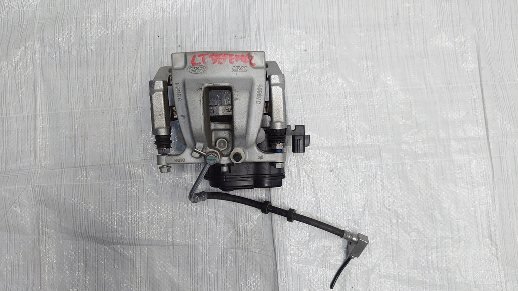 фото №1, Land rover defender l663 супорт гальмівний лівий задня