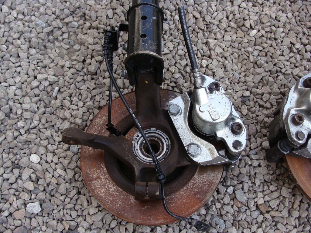 фото №6, Амортизатор поворотный кулак левая dacia sandero logan 1.2