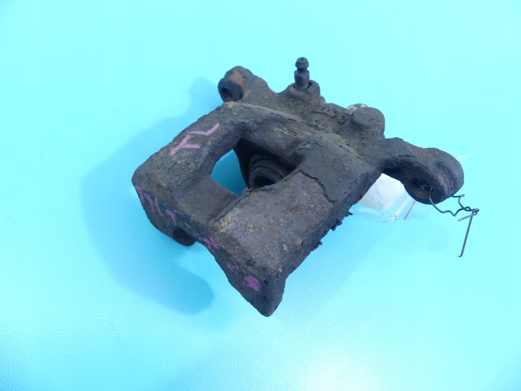 фото №1, Суппорт задняя левый nissan tiida 1.5 dci