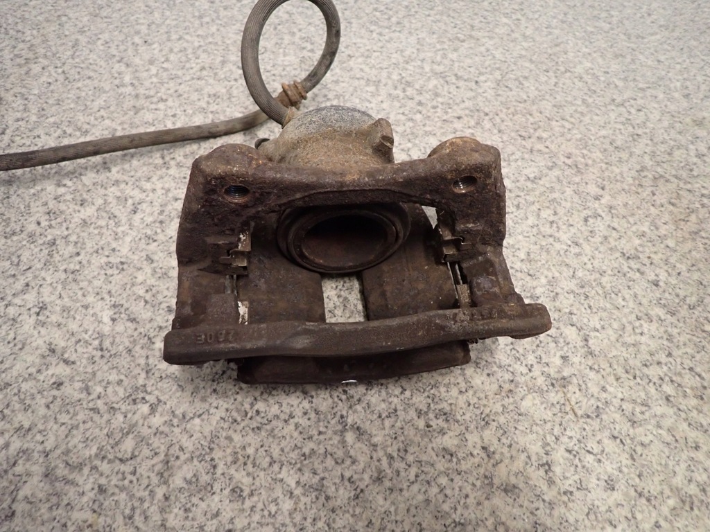 фото №4, Nissan note e11 супорт гальмівний перед лівий