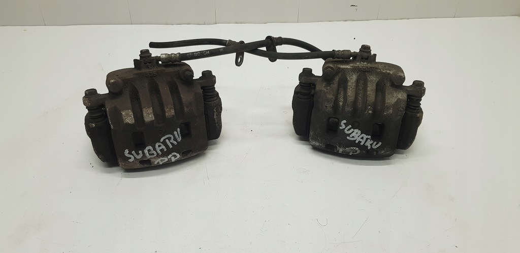 фото №1, Subaru forester ii суппорт тормозной передний левый